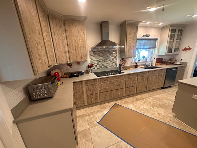 Large l-shaped eat-in kitchen photo with an undermount sink, flat-panel cabinets, medium tone wood cabinets, stainless steel appliances and an island