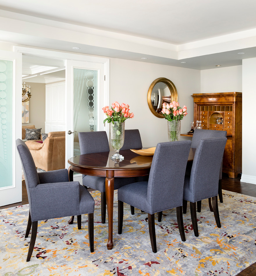 Photo of a mid-sized contemporary dining room in Toronto with carpet, beige walls and no fireplace.