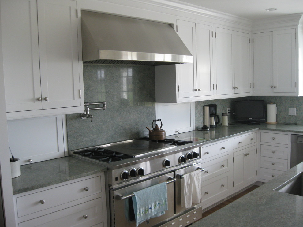 Kitchen - large transitional galley medium tone wood floor kitchen idea in Providence with an undermount sink, white cabinets, granite countertops, green backsplash, stainless steel appliances, an island, shaker cabinets and stone slab backsplash