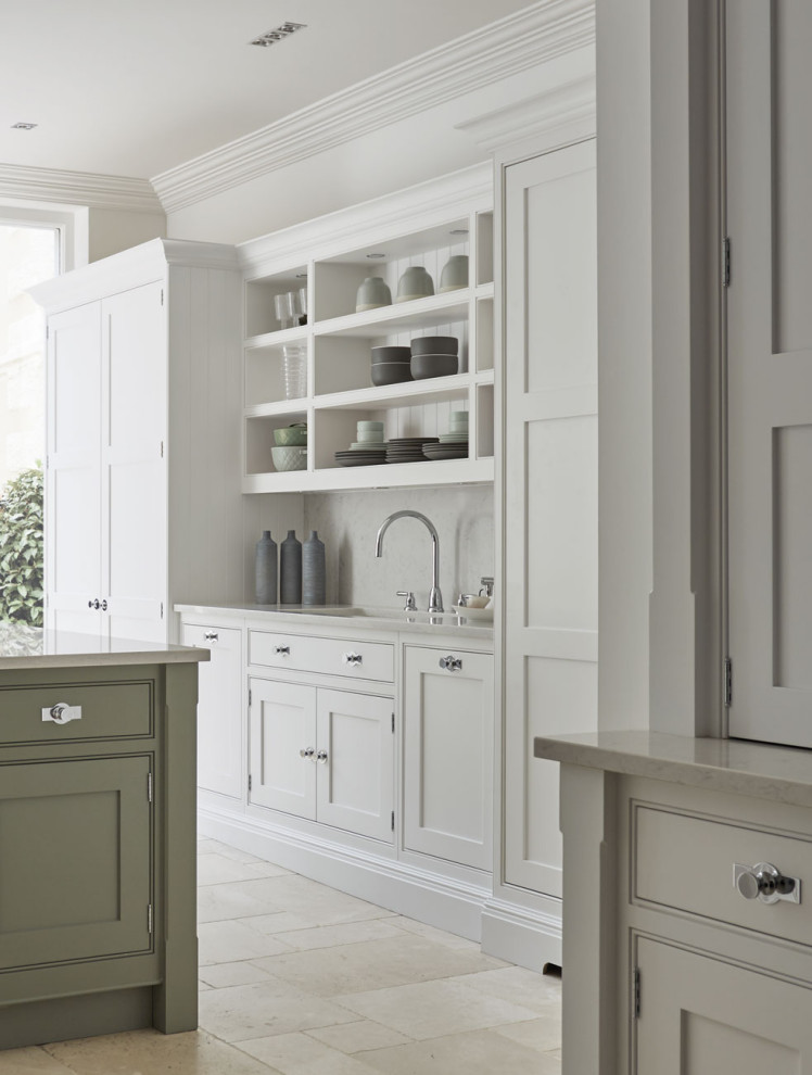 Inspiration for a mid-sized country u-shaped eat-in kitchen in Manchester with shaker cabinets, white cabinets, quartzite benchtops, white splashback, engineered quartz splashback, marble floors, with island, beige floor and white benchtop.