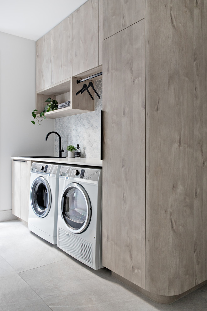 This is an example of a scandinavian laundry room in Central Coast.