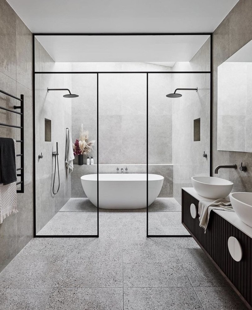 This is an example of a large modern master bathroom in Los Angeles with beaded inset cabinets, medium wood cabinets, a curbless shower, a one-piece toilet, white tile, ceramic tile, white walls, ceramic floors, a drop-in sink, engineered quartz benchtops, grey floor, a hinged shower door and white benchtops.
