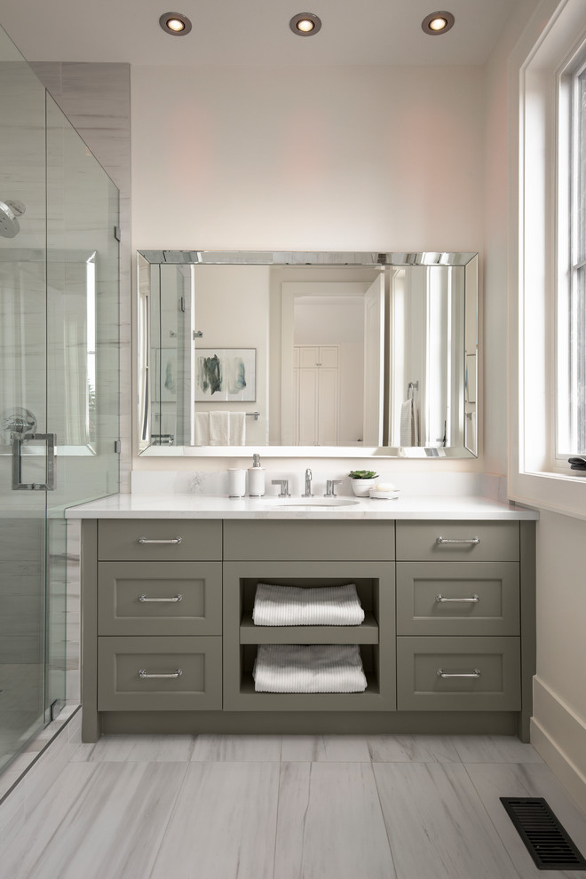 This is an example of a transitional kids bathroom in Calgary with recessed-panel cabinets, grey cabinets, an alcove shower, a one-piece toilet, white walls, porcelain floors, an undermount sink, engineered quartz benchtops, white floor, a hinged shower door, yellow benchtops and stone slab.