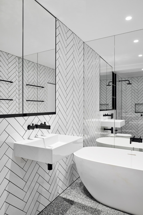 Sophisticated Contrast: White Herringbone Walls with Black Grout
