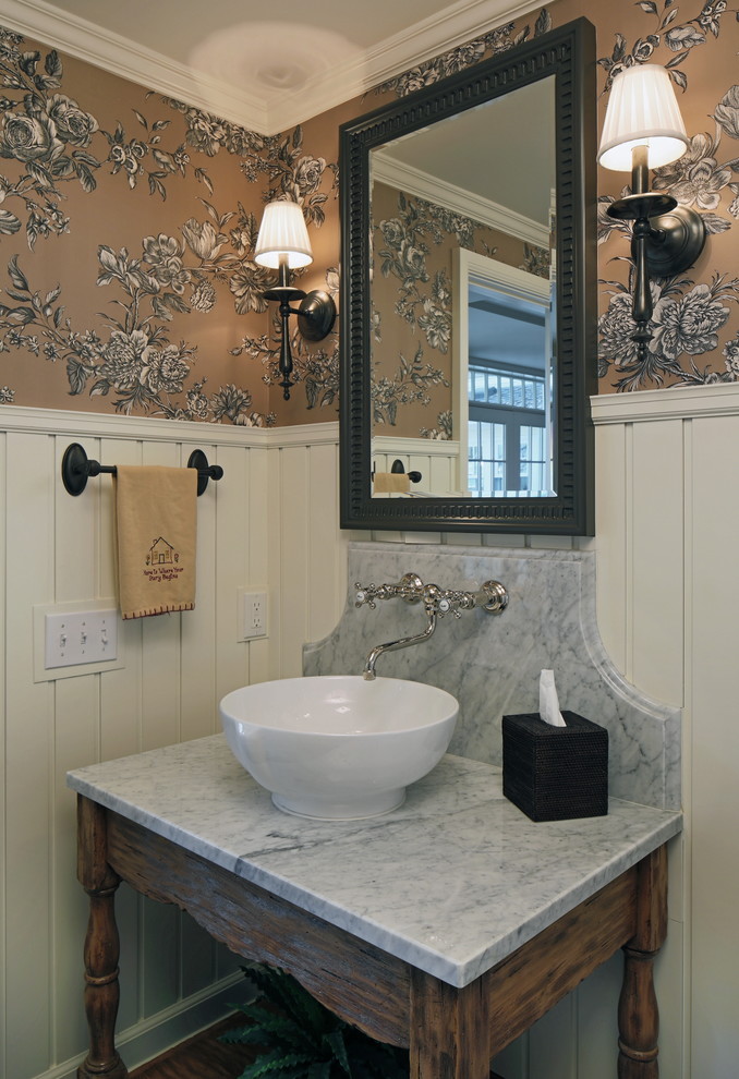 Design ideas for a traditional powder room in Omaha with marble benchtops, a vessel sink and grey benchtops.