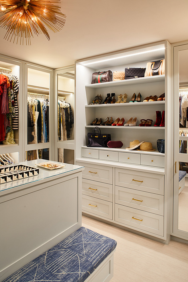 Design ideas for a large transitional women's dressing room in New York.
