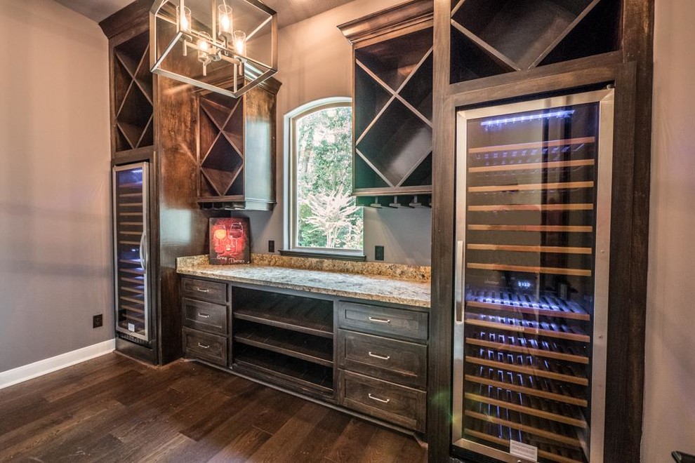 This is an example of a mid-sized transitional wine cellar in Houston with medium hardwood floors and diamond bins.