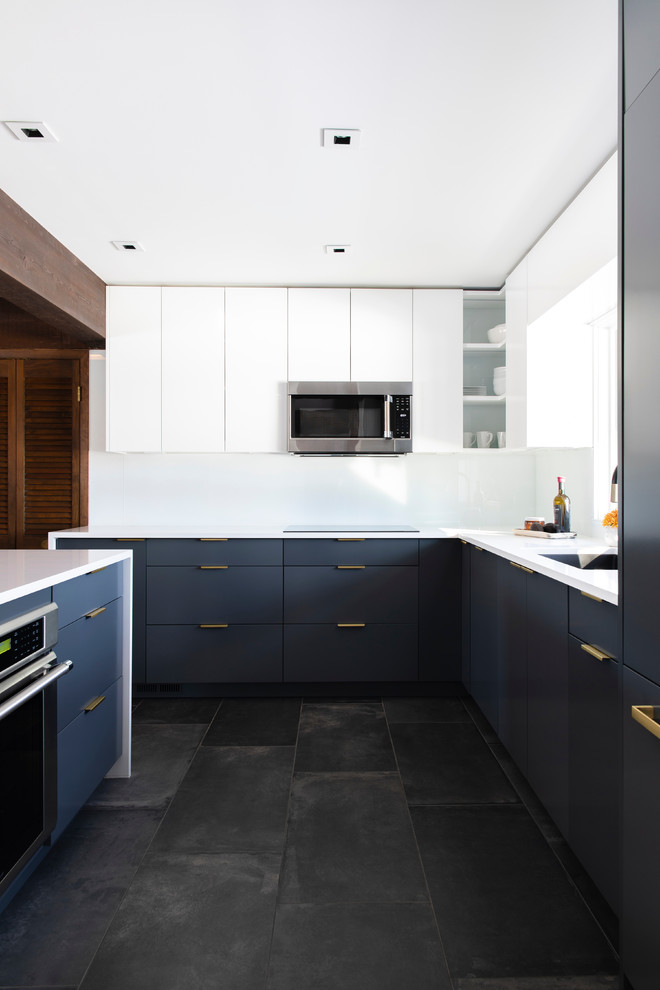 Design ideas for a small midcentury l-shaped open plan kitchen in Omaha with an undermount sink, flat-panel cabinets, grey cabinets, quartzite benchtops, white splashback, glass sheet splashback, panelled appliances, porcelain floors, a peninsula, black floor and white benchtop.