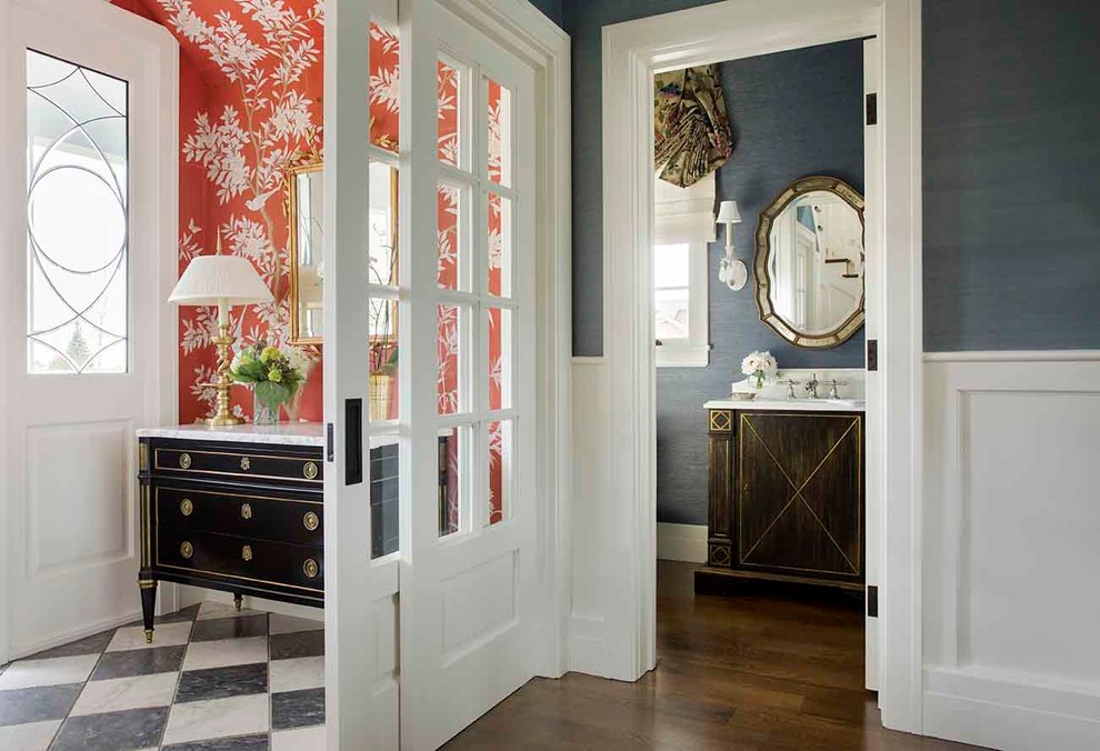 Photo of an expansive traditional foyer in Los Angeles with blue walls, marble floors, a double front door and a white front door.