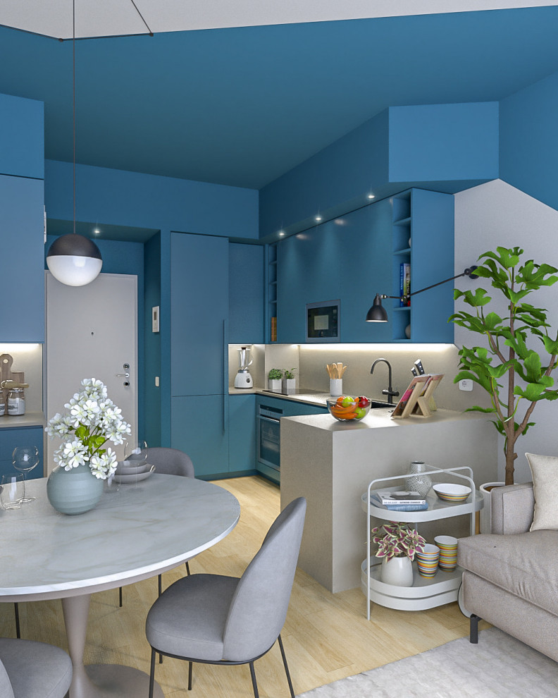 Photo of a small contemporary u-shaped open plan kitchen in Milan with a single-bowl sink, flat-panel cabinets, blue cabinets, quartz benchtops, beige splashback, engineered quartz splashback, stainless steel appliances, light hardwood floors, no island, beige benchtop and recessed.
