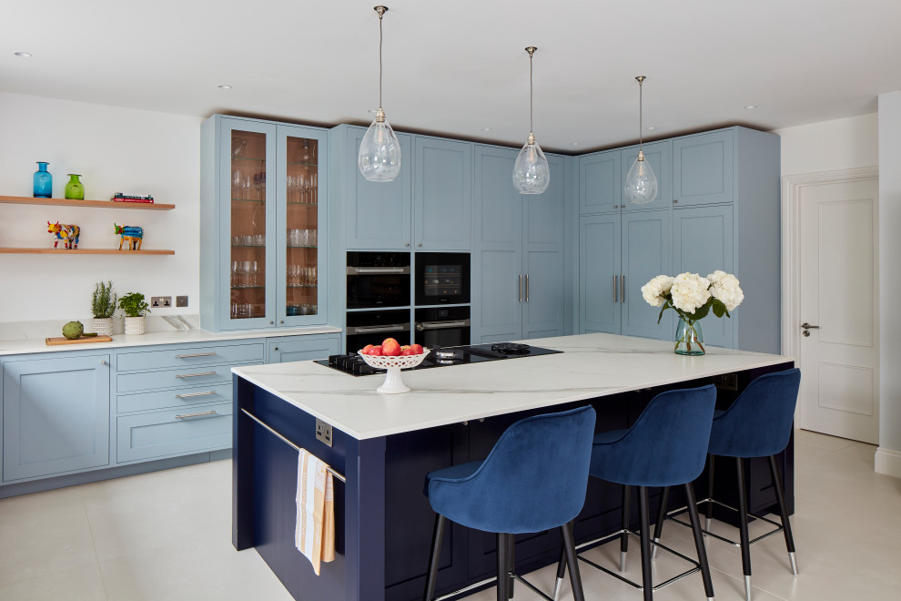 This is an example of a large scandi u-shaped kitchen in London with an island.