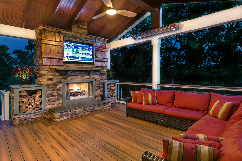 Inspiration for a country deck in Charlotte with a fire feature and a roof extension.