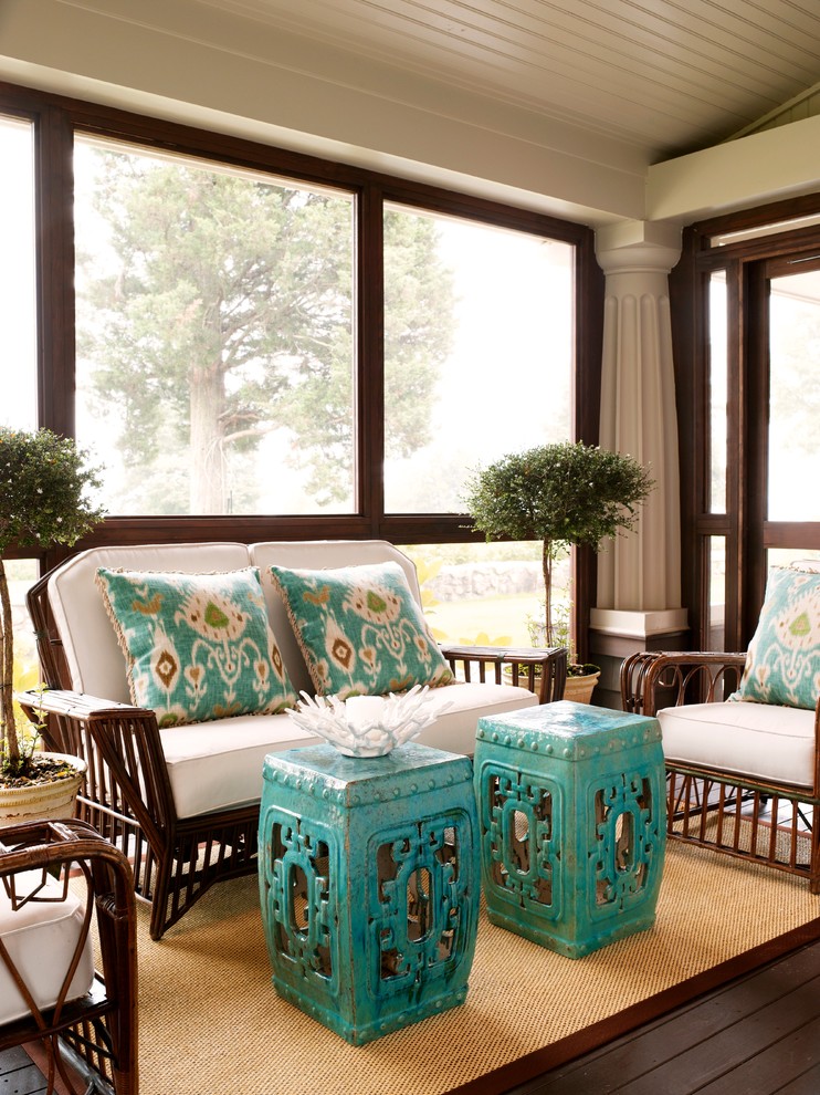This is an example of a beach style sunroom in New York with dark hardwood floors, a standard ceiling and brown floor.