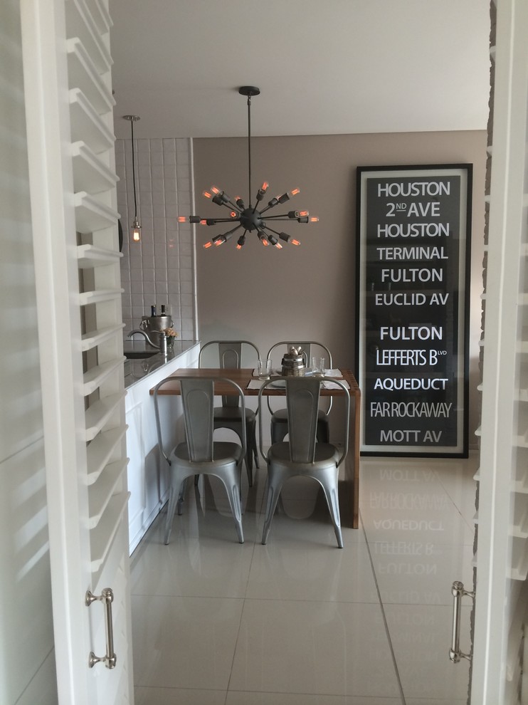 Kitchen/dining room combo - small industrial ceramic tile kitchen/dining room combo idea with brown walls