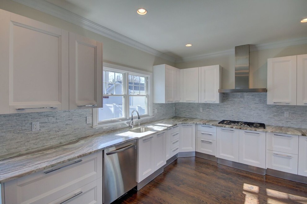 Mid-sized transitional u-shaped brown floor kitchen photo in New York with shaker cabinets, white cabinets, quartz countertops, gray backsplash and gray countertops
