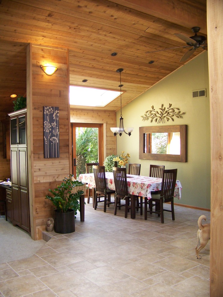 Traditional dining room in San Diego with green walls.