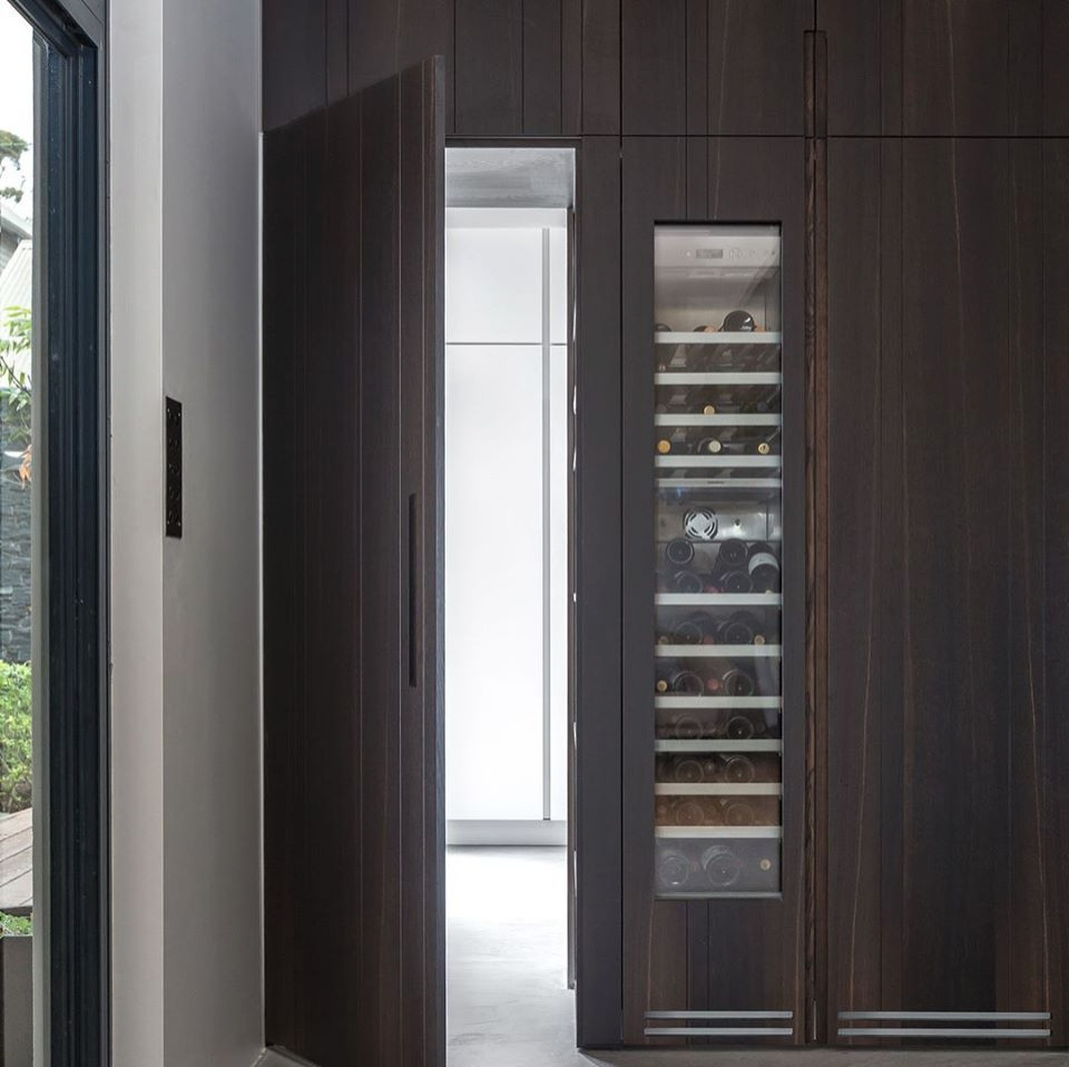 Photo of a mid-sized contemporary kitchen pantry in Perth with terrazzo floors, with island and grey floor.