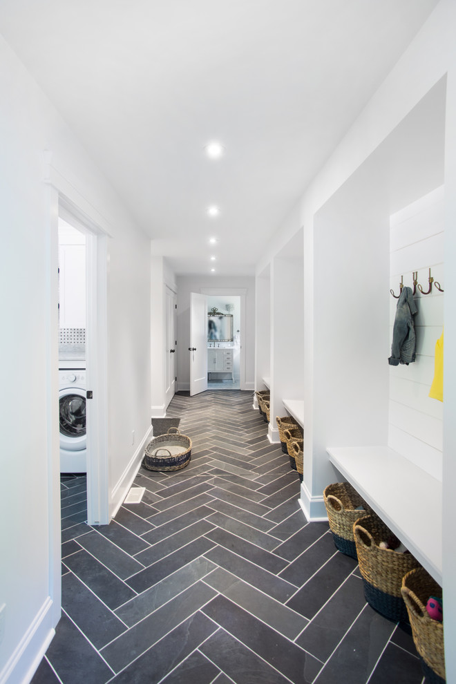 This is an example of a mid-sized transitional hallway in Toronto with white walls, porcelain floors and multi-coloured floor.