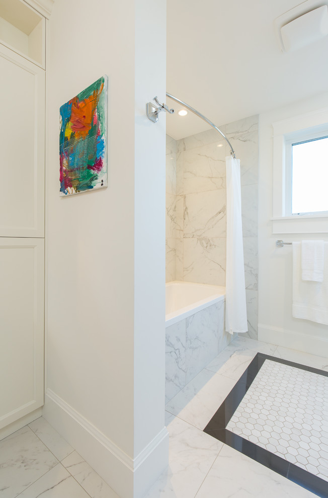 Inspiration for a traditional bathroom in Vancouver with recessed-panel cabinets, white cabinets, a drop-in tub, a shower/bathtub combo, marble, white walls, marble floors, a drop-in sink, marble benchtops and a shower curtain.