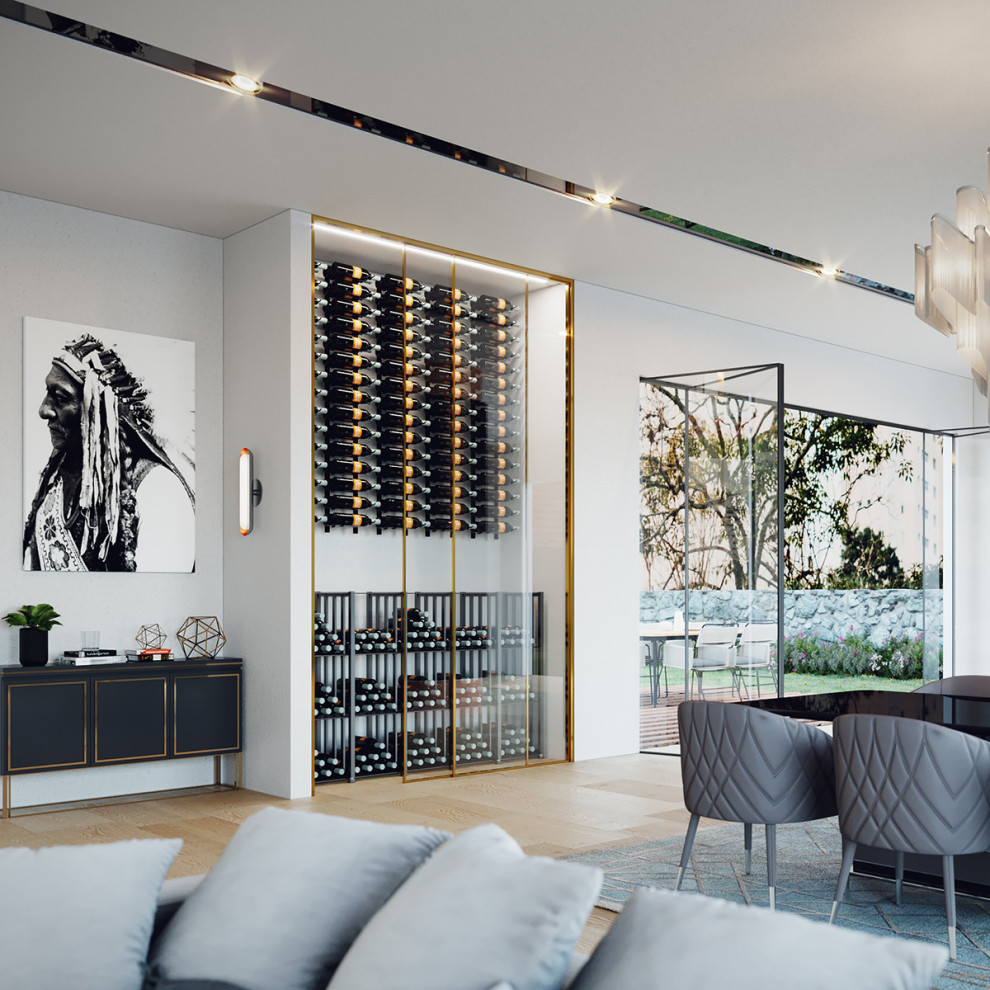 Photo of a mid-sized contemporary wine cellar in Denver with display racks.