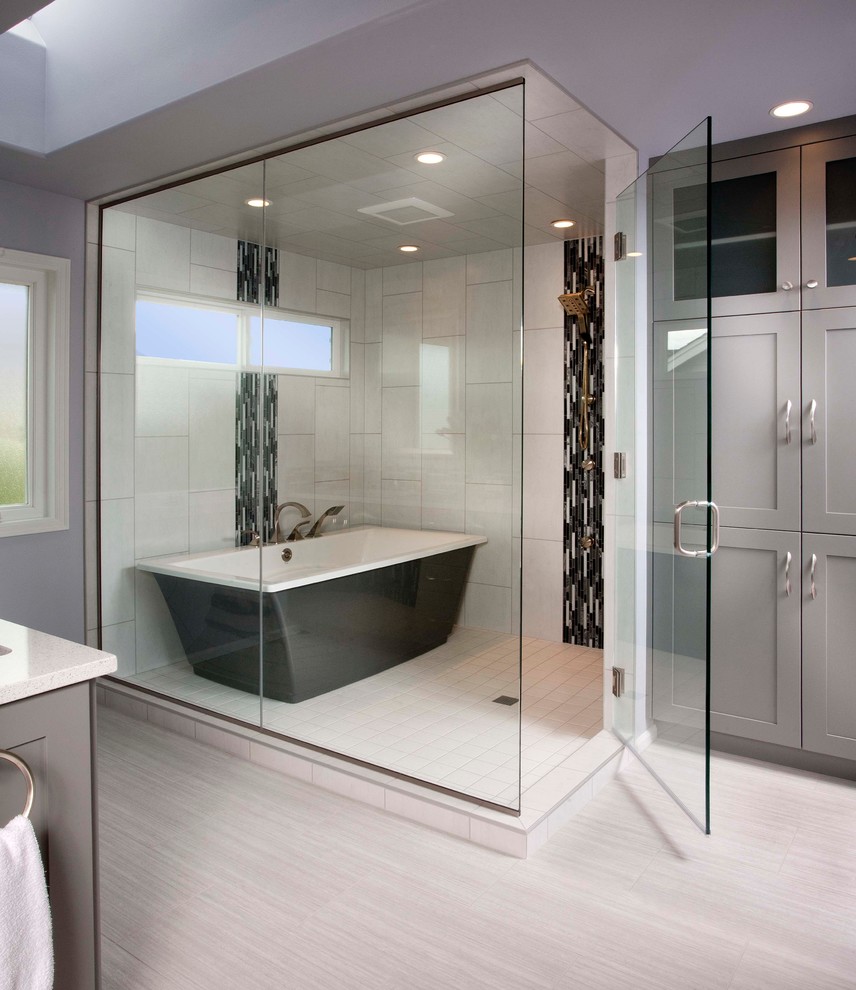Example of a large transitional master porcelain tile and white tile porcelain tile bathroom design in Seattle with an undermount sink, shaker cabinets, gray cabinets, quartz countertops and gray walls