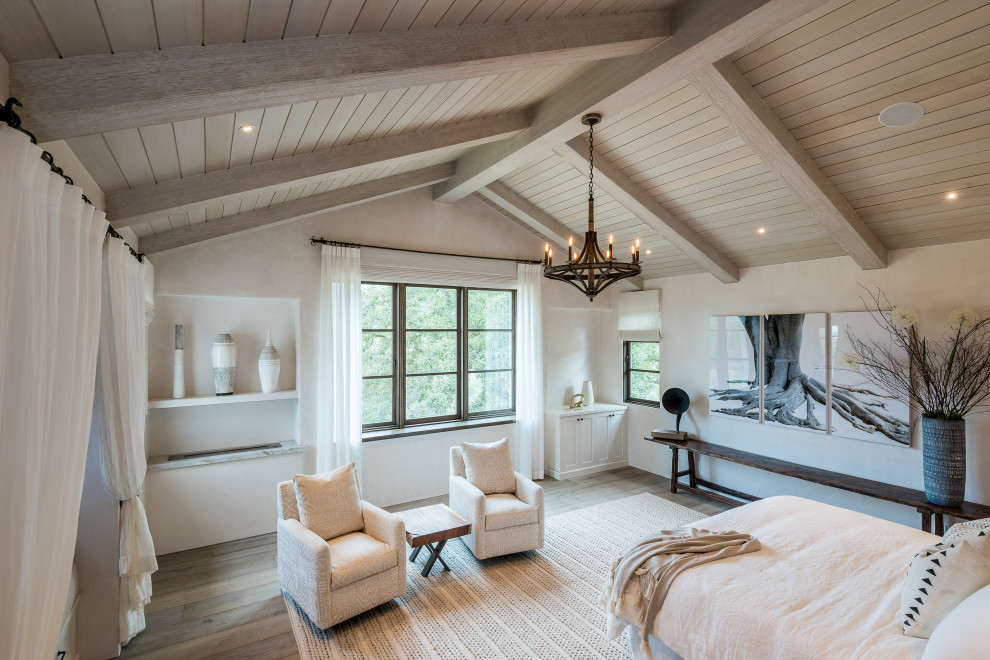 Photo of a country bedroom in Charlotte with exposed beams.