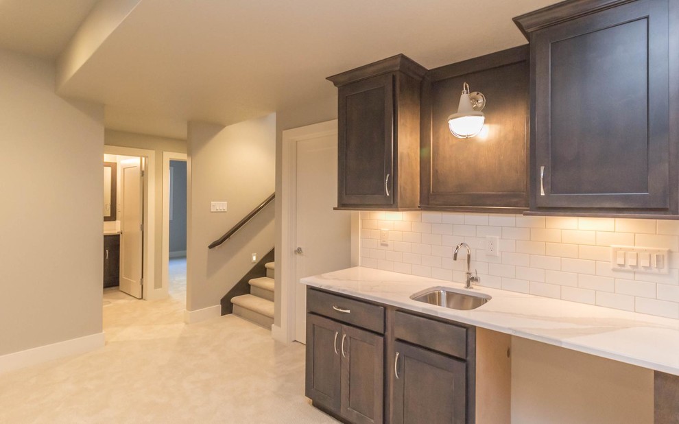 Basement - mid-sized transitional underground carpeted basement idea with gray walls and no fireplace