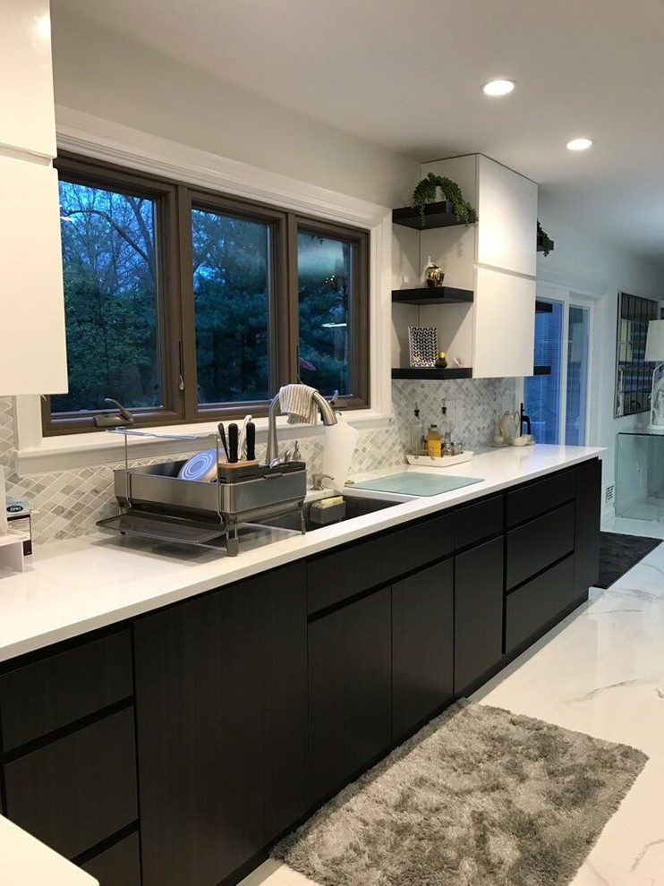 Mid-sized contemporary galley eat-in kitchen in New York with an undermount sink, flat-panel cabinets, dark wood cabinets, quartz benchtops, grey splashback, ceramic splashback, stainless steel appliances, porcelain floors, with island and white floor.