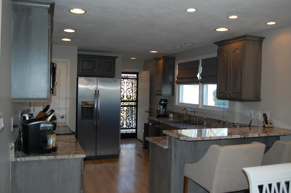 Kitchen - transitional kitchen idea with raised-panel cabinets