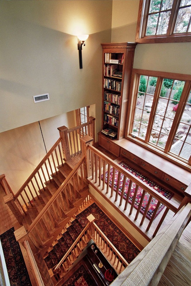Inspiration for a mid-sized arts and crafts wood u-shaped staircase in Other with wood risers.