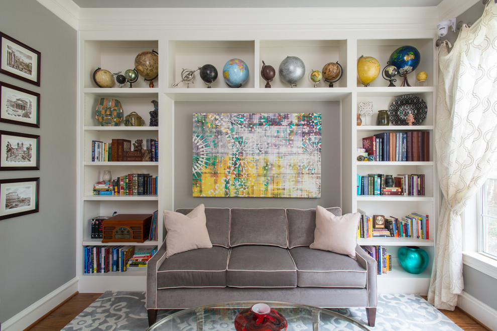 Example of a mid-sized transitional formal and enclosed medium tone wood floor and brown floor living room design in Dallas with gray walls, no fireplace and no tv