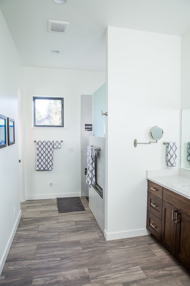 Mid-sized transitional master gray tile and porcelain tile porcelain tile and gray floor walk-in shower photo with shaker cabinets, dark wood cabinets, white walls, an undermount sink and quartzite countertops