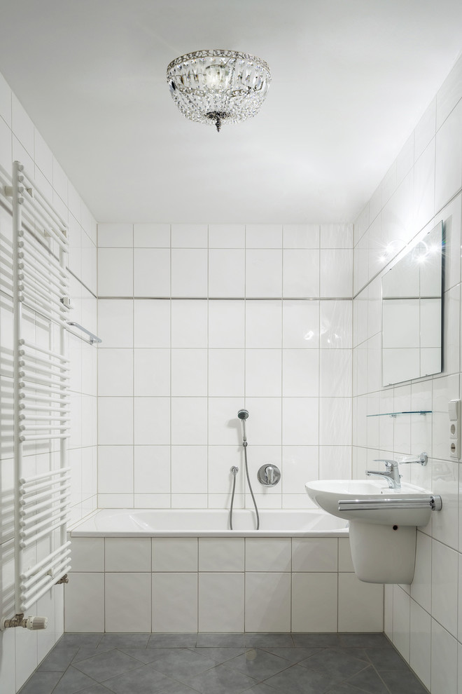Design ideas for a small scandinavian 3/4 bathroom in Stockholm with a console sink, a corner tub, a shower/bathtub combo, white tile and white walls.