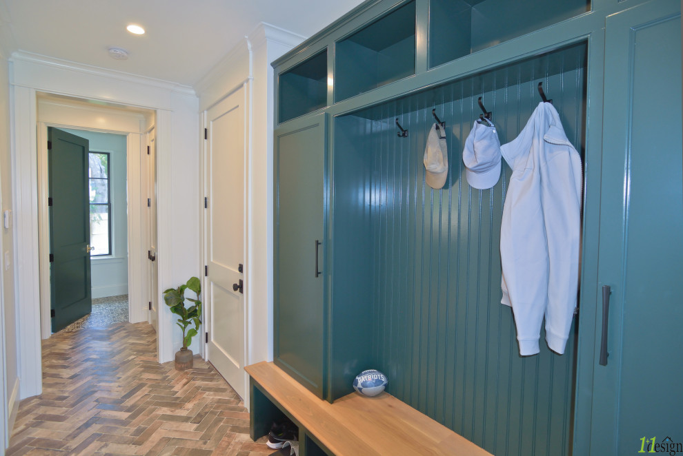 Inspiration for a large transitional slate floor and multicolored floor mudroom remodel in Boston with white walls