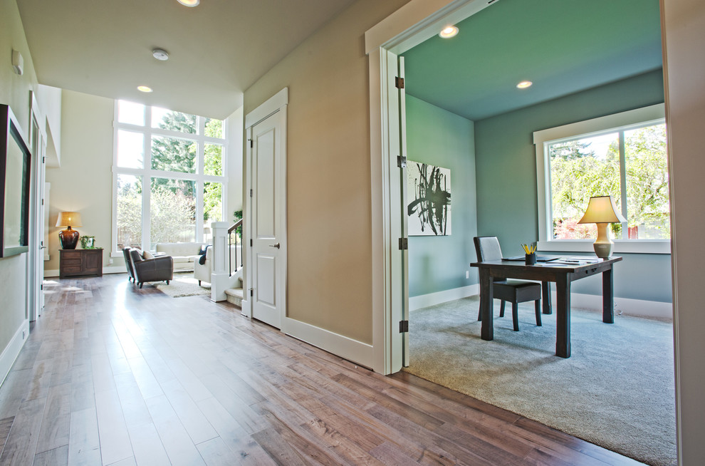Large transitional hallway in Seattle with grey walls and medium hardwood floors.