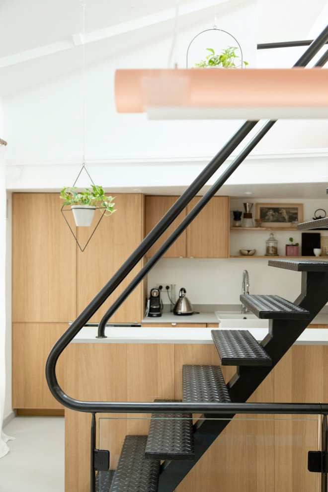 Inspiration for a contemporary metal straight staircase in Paris with open risers and glass railing.
