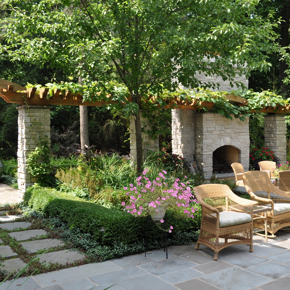 Inspiration for a traditional patio in Chicago with with fireplace.