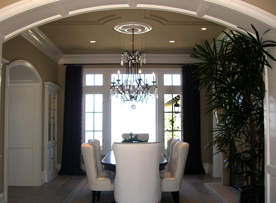 Inspiration for an expansive contemporary separate dining room in Orange County with beige walls and porcelain floors.