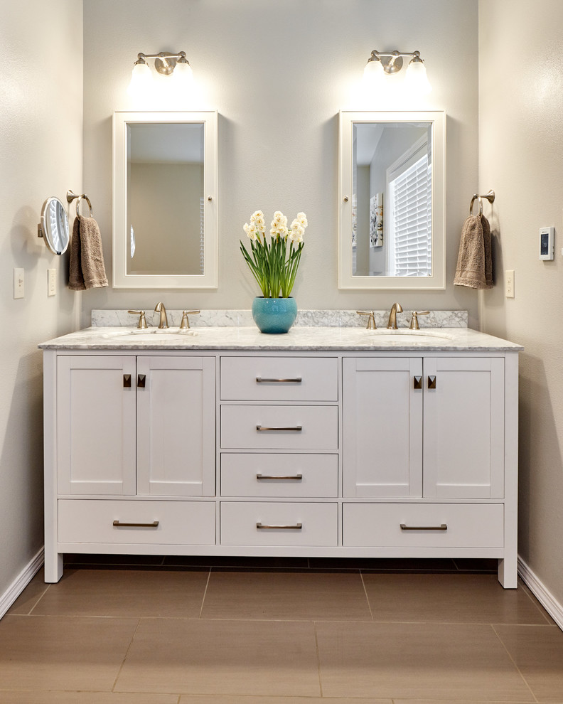 Design ideas for a large master bathroom in Other with recessed-panel cabinets, white cabinets, porcelain floors, an undermount sink, marble benchtops, beige floor, grey benchtops and grey walls.