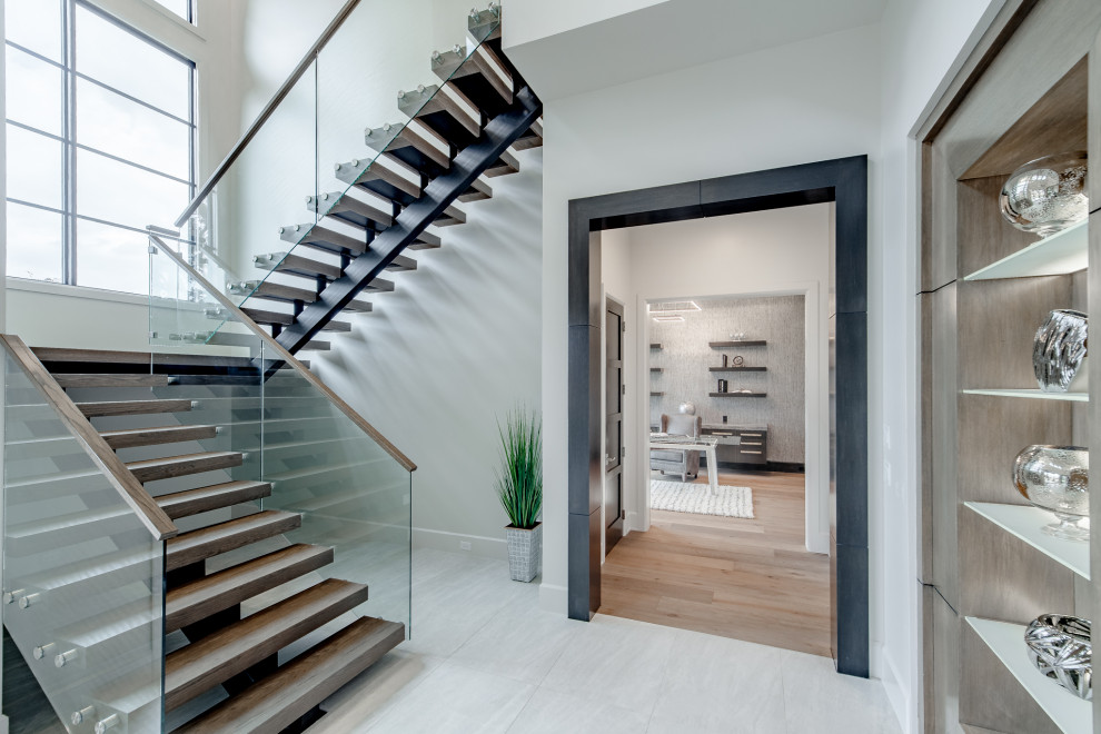 Photo of a contemporary floating staircase in Dallas with open risers.