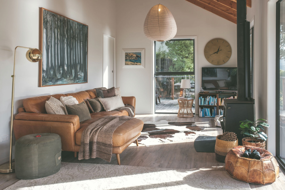 Design ideas for an eclectic open concept family room in Christchurch.