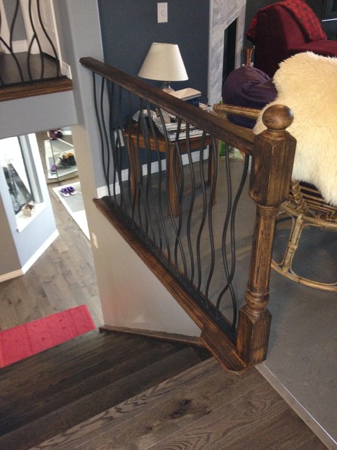 BENT iron design interior railing with a distressed wood handrail and base montagne-escalier