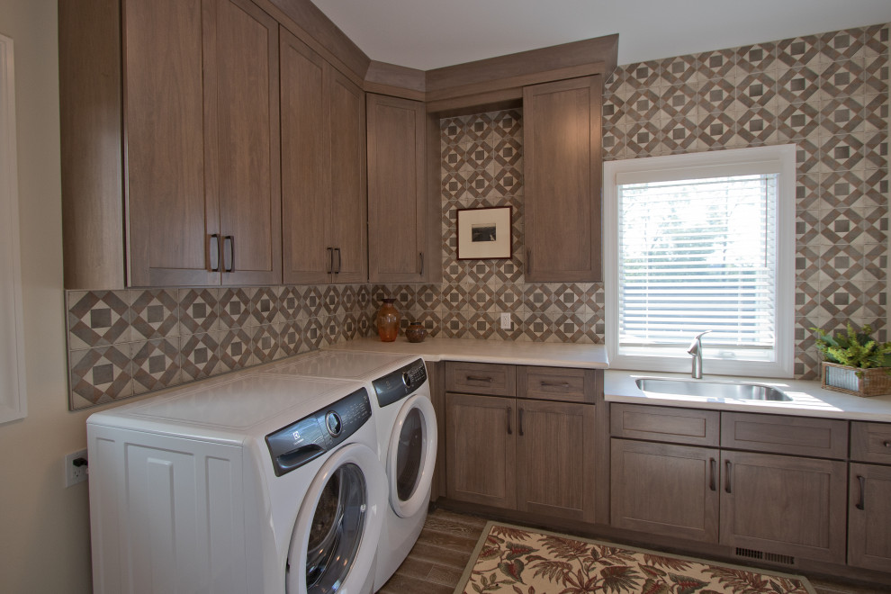 This is an example of a traditional l-shaped dedicated laundry room in Other with a side-by-side washer and dryer and beige benchtop.