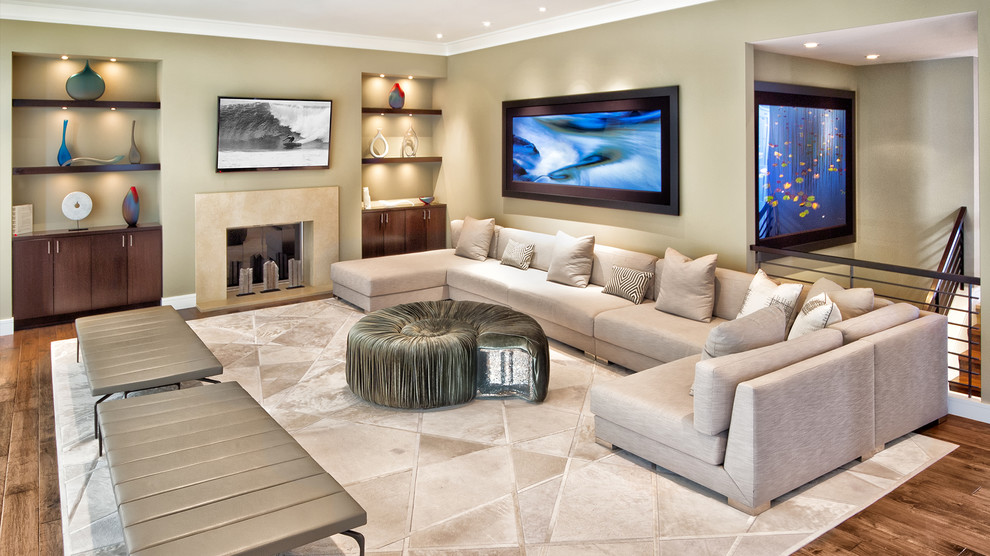 Inspiration for an expansive contemporary formal open concept living room in Orange County with beige walls, medium hardwood floors, a wall-mounted tv and brown floor.
