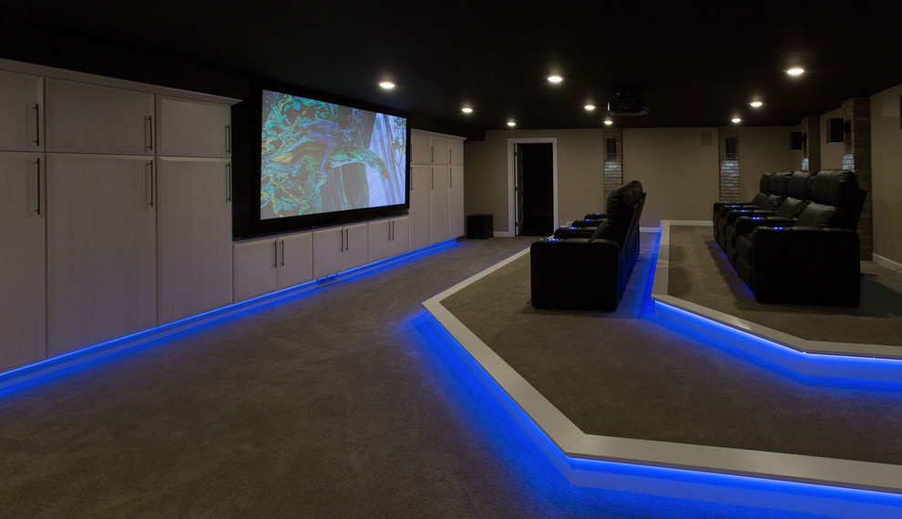 Photo of a contemporary home theatre in Other with white walls, carpet and a projector screen.