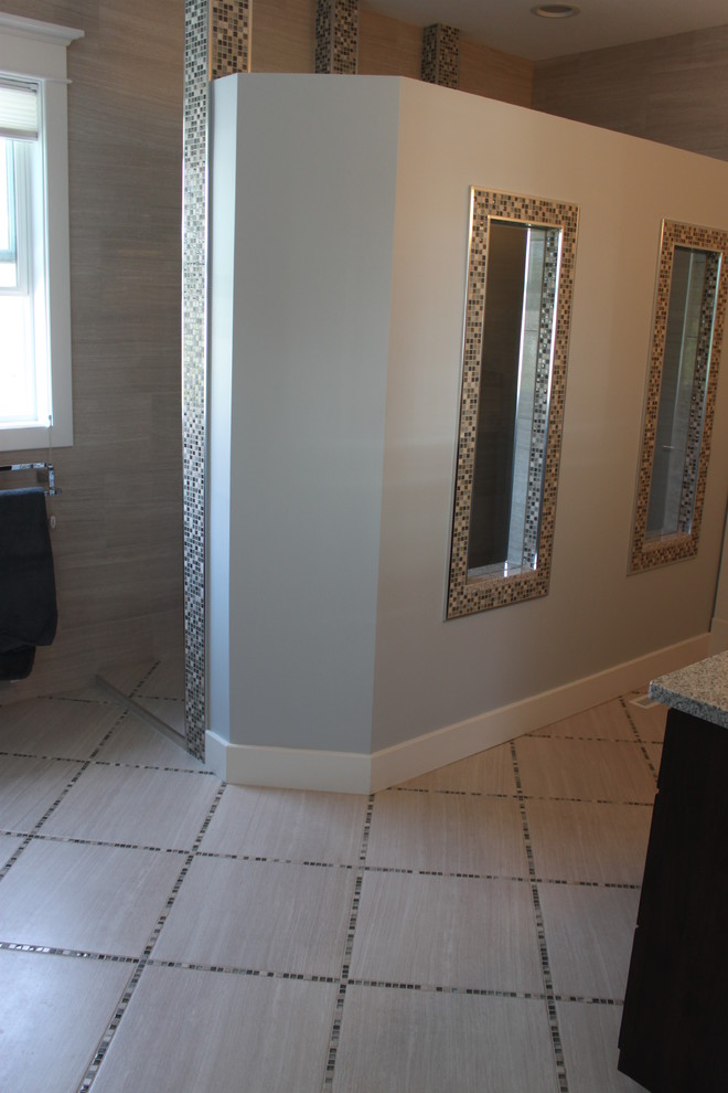 Doorless shower - large transitional master gray tile and porcelain tile porcelain tile doorless shower idea with dark wood cabinets, granite countertops and blue walls
