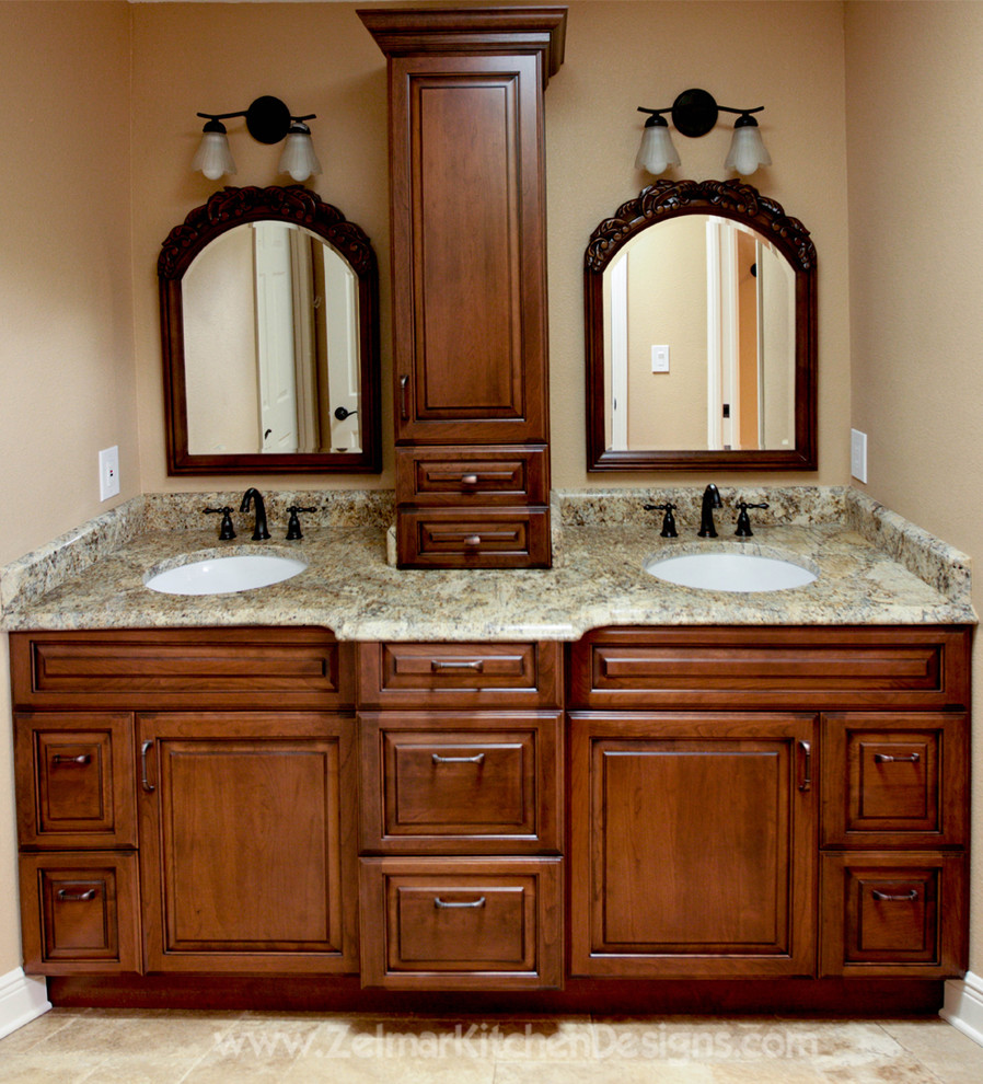 Design ideas for a mid-sized traditional master bathroom in Orlando with an undermount sink, raised-panel cabinets, dark wood cabinets, granite benchtops, beige tile and stone tile.