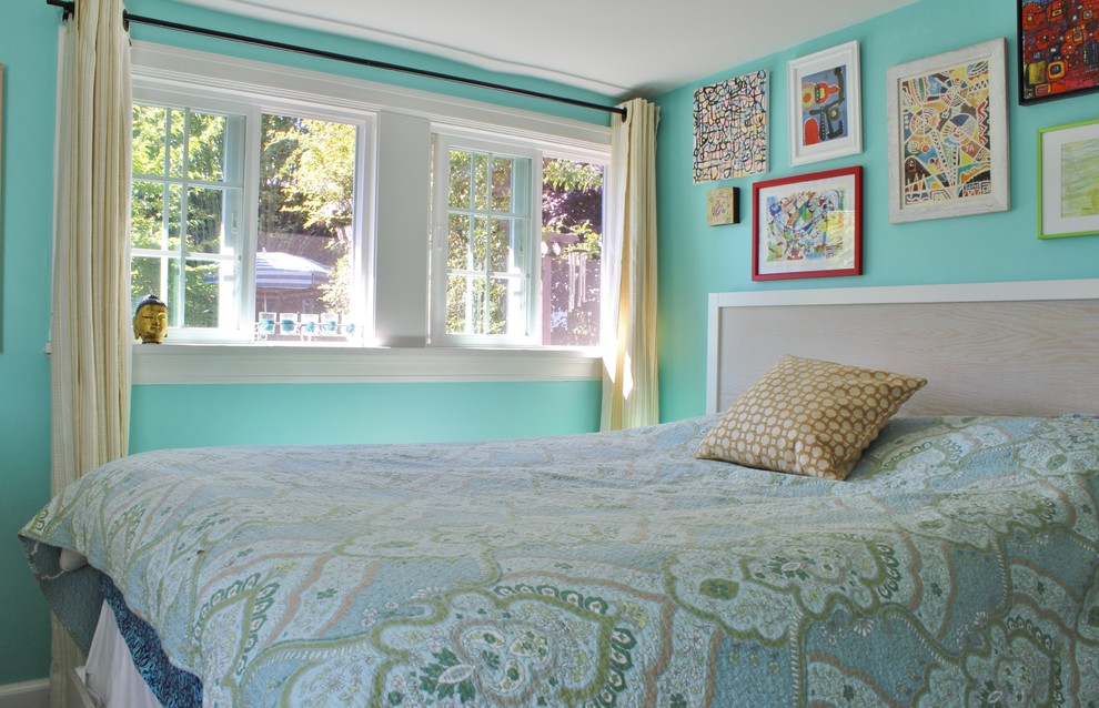 This is an example of a contemporary bedroom in Seattle with blue walls.