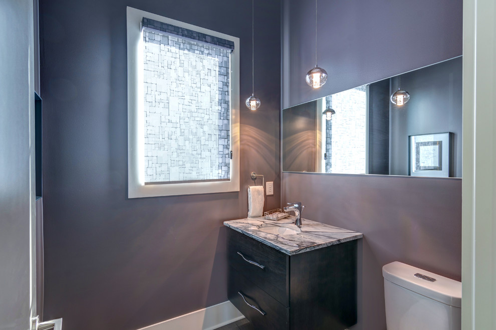 Inspiration for a small contemporary powder room in Indianapolis with flat-panel cabinets, dark wood cabinets, a one-piece toilet, grey walls, dark hardwood floors, an undermount sink, engineered quartz benchtops and brown floor.