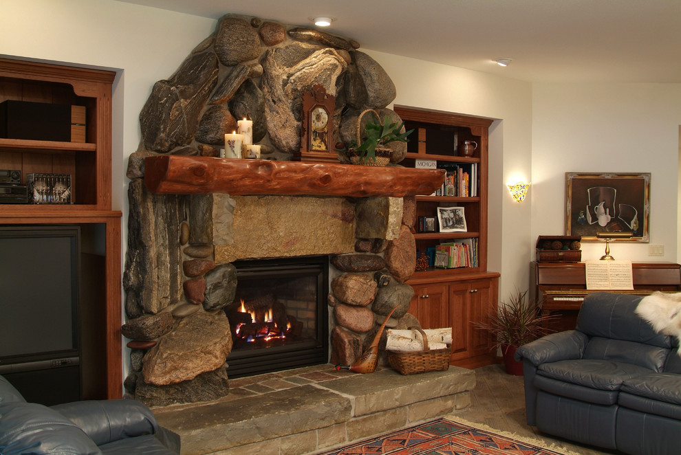 Inspiration for a large country walk-out basement in Other with white walls, porcelain floors, a standard fireplace, a stone fireplace surround and brown floor.